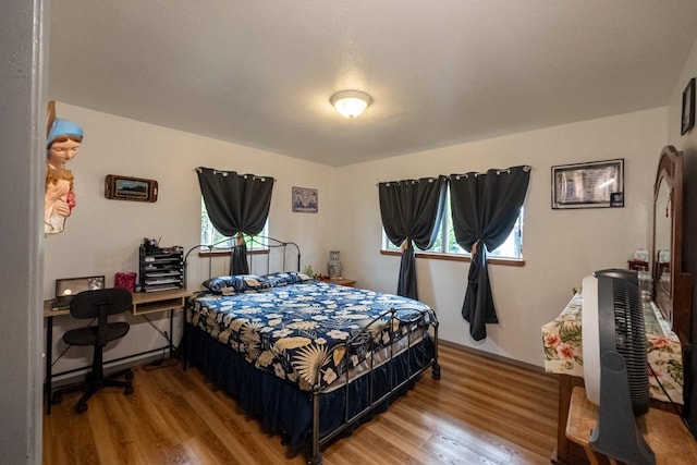 bedroom with wood-type flooring