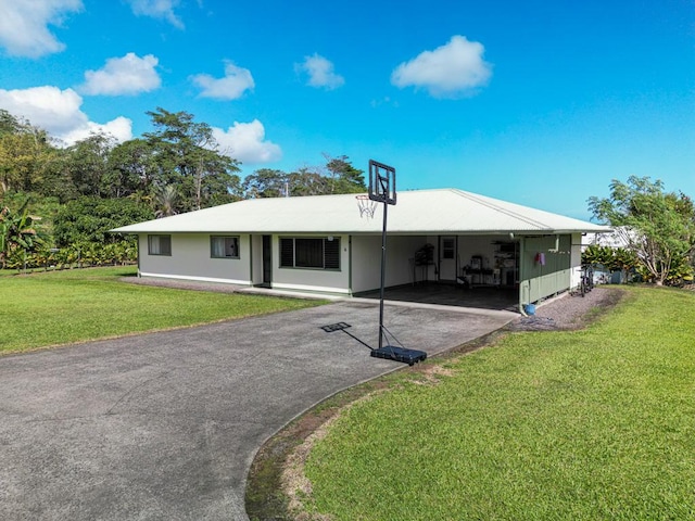 ranch-style house featuring a carport and a front yard