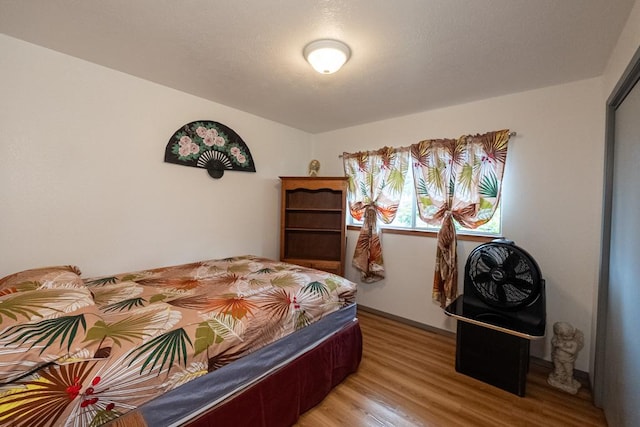 bedroom with light hardwood / wood-style floors