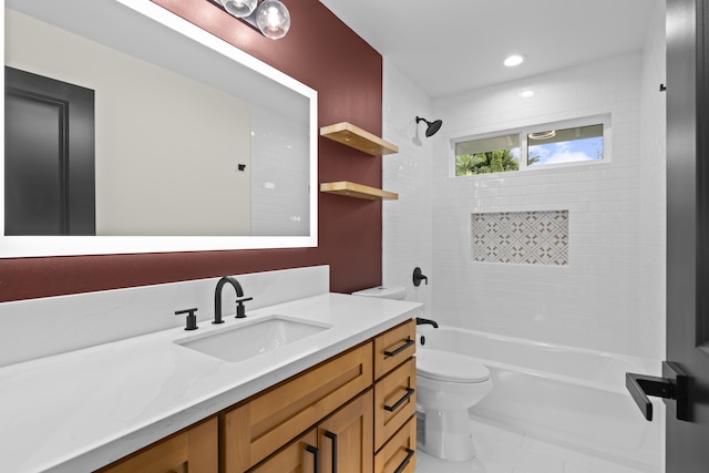 full bathroom featuring vanity, toilet, and tiled shower / bath