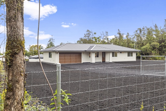 ranch-style home featuring a garage