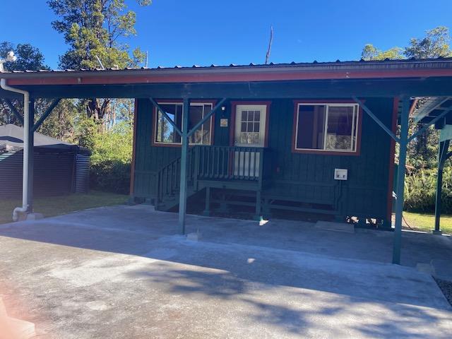 view of front facade with a carport