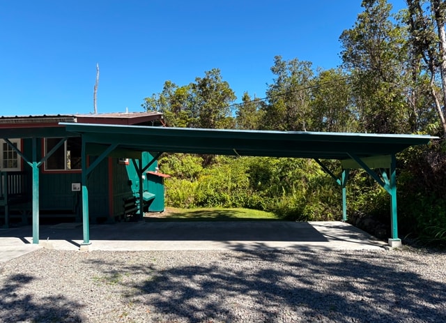 view of vehicle parking featuring a carport