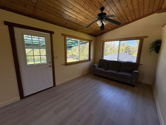 living room with wood ceiling, ceiling fan, light hardwood / wood-style floors, and vaulted ceiling