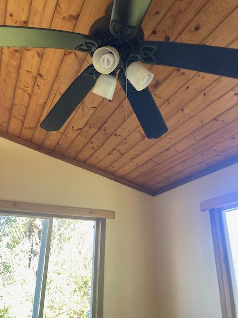 room details featuring wooden ceiling and ceiling fan