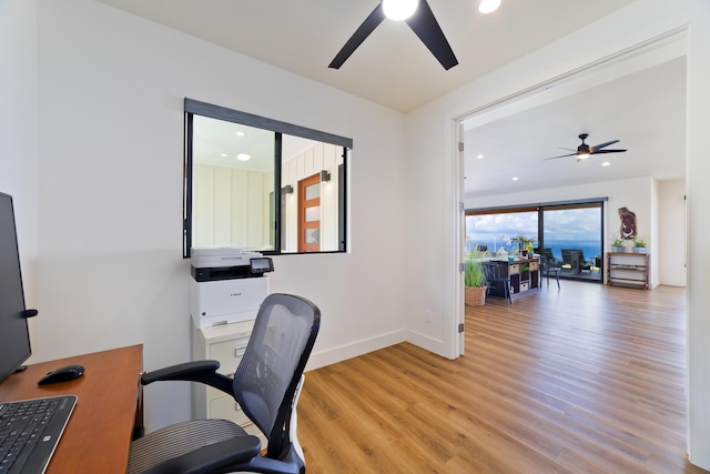 home office featuring ceiling fan and light wood-type flooring