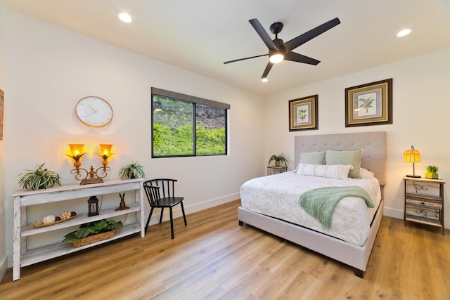 bedroom featuring hardwood / wood-style floors and ceiling fan