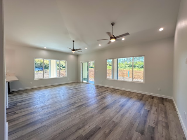 spare room featuring ceiling fan and dark hardwood / wood-style floors