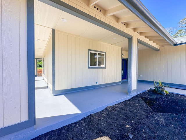 entrance to property with a patio area