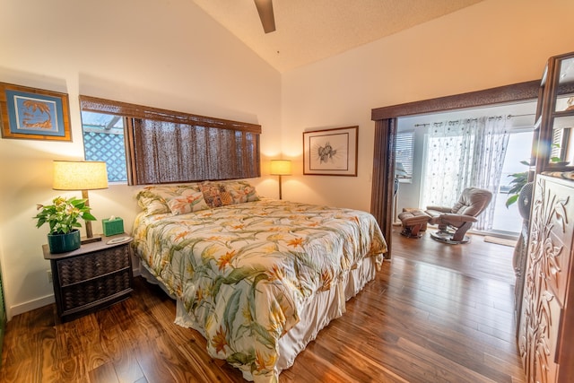 bedroom featuring dark wood-type flooring, ceiling fan, and lofted ceiling