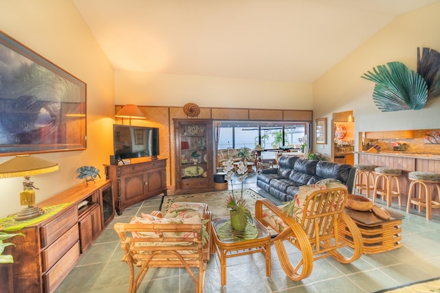 tiled living room with vaulted ceiling