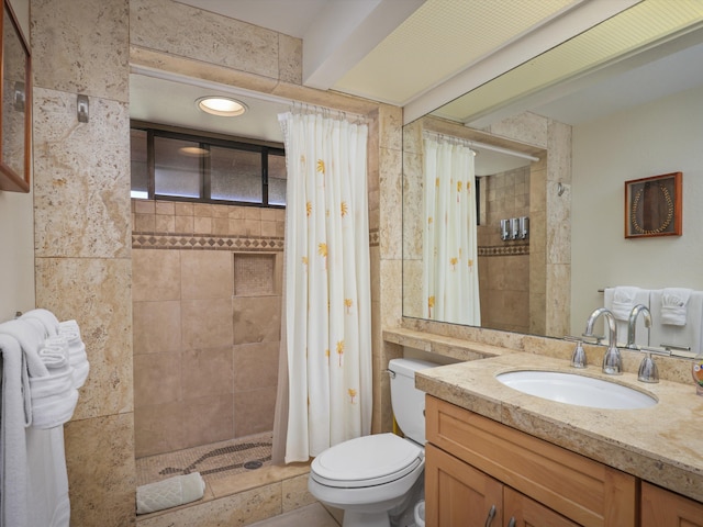 bathroom with a shower with shower curtain, vanity, and toilet