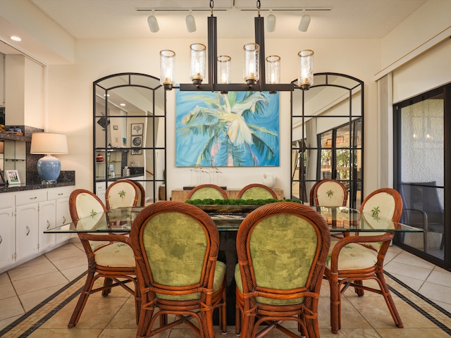 tiled dining space featuring a chandelier