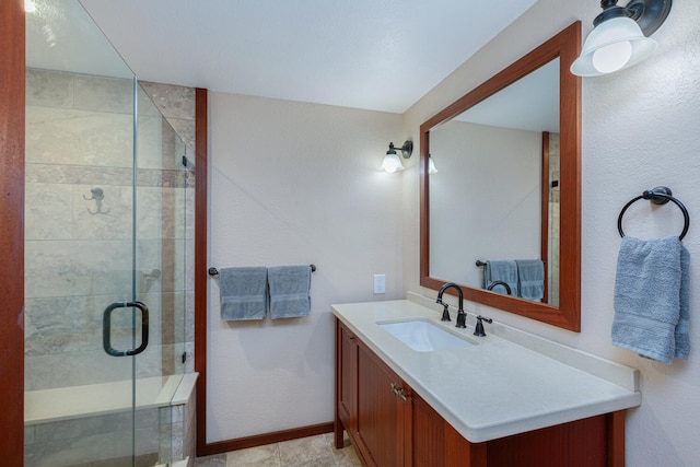 bathroom with vanity and a shower with shower door