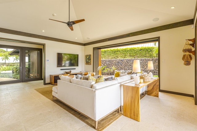 living room featuring ceiling fan, plenty of natural light, and high vaulted ceiling