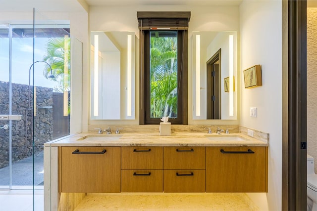 bathroom with toilet and vanity