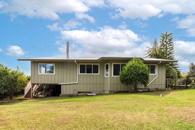 back of house with a yard