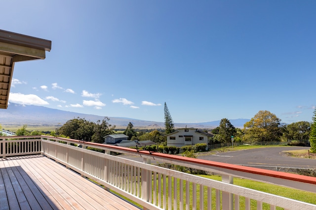 wooden deck with a mountain view