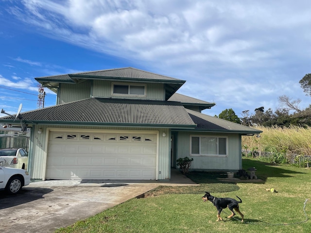 front facade with a front yard and a garage