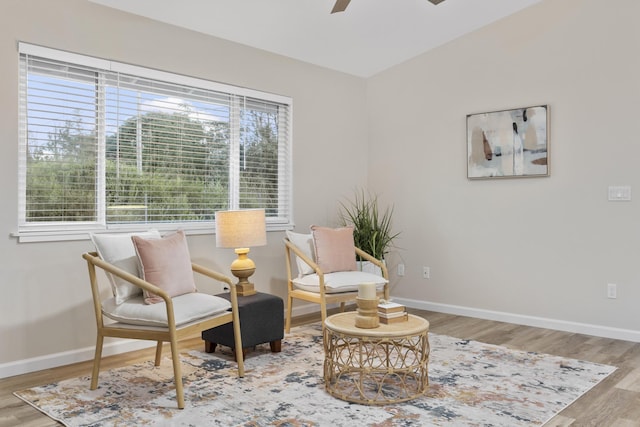 sitting room featuring ceiling fan and light hardwood / wood-style flooring