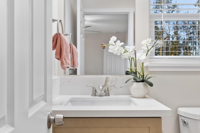 bathroom featuring toilet and vanity