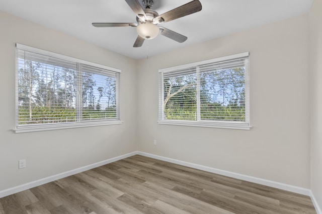 spare room with ceiling fan and light hardwood / wood-style flooring