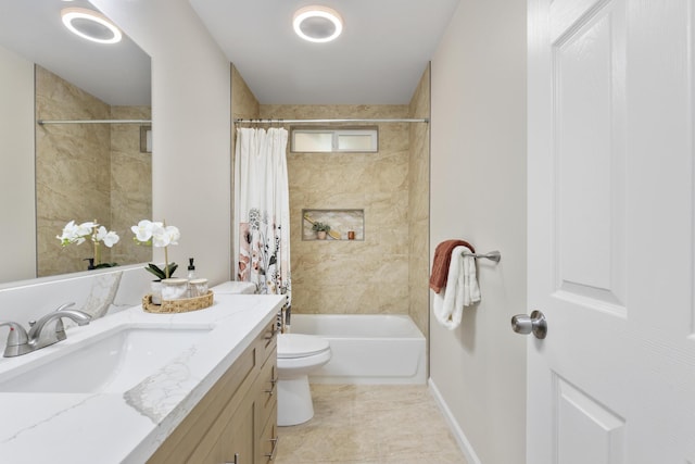 full bathroom featuring toilet, vanity, and shower / bath combo with shower curtain