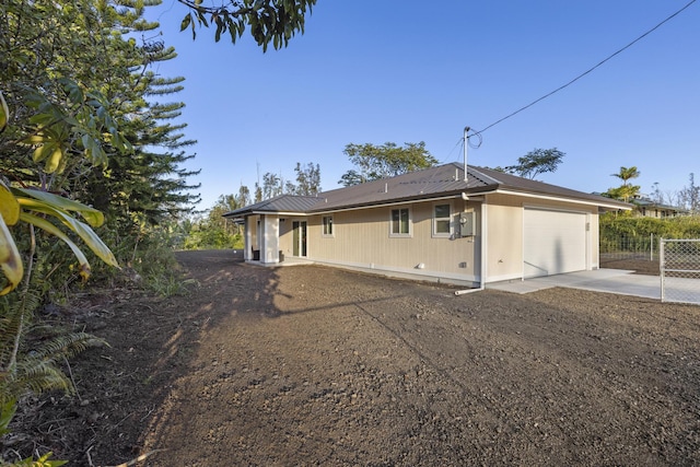 view of side of property featuring a garage