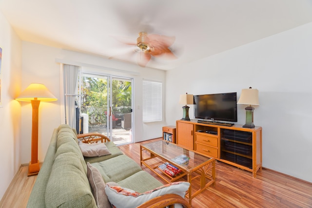 living room with ceiling fan and light hardwood / wood-style floors