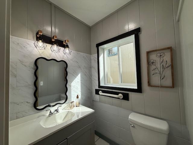 bathroom with toilet and vanity