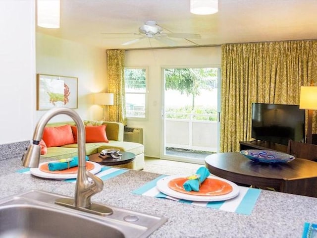 interior space featuring sink and ceiling fan