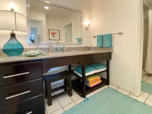 bathroom with tile patterned flooring and sink