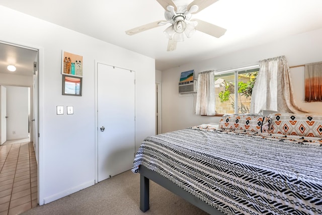 carpeted bedroom featuring ceiling fan and a closet