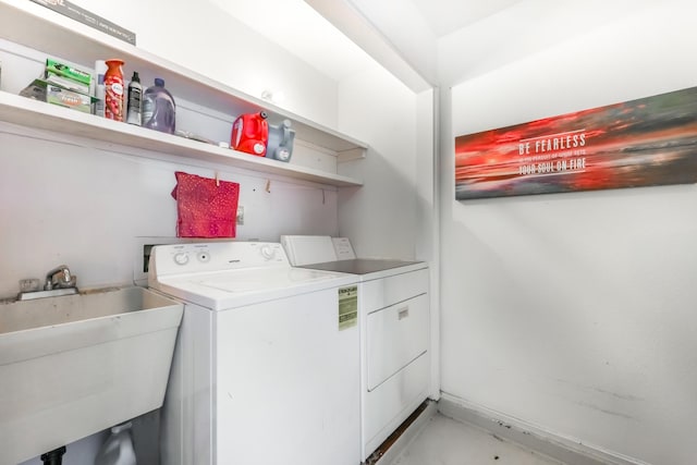 washroom featuring washer and dryer and sink