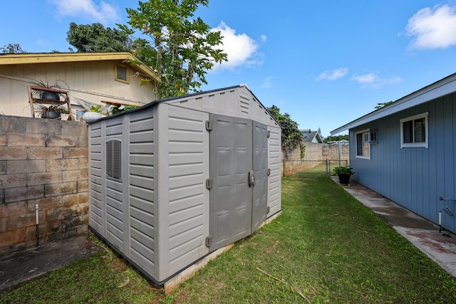 view of outdoor structure featuring a lawn