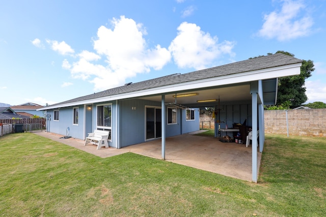 rear view of house with a yard