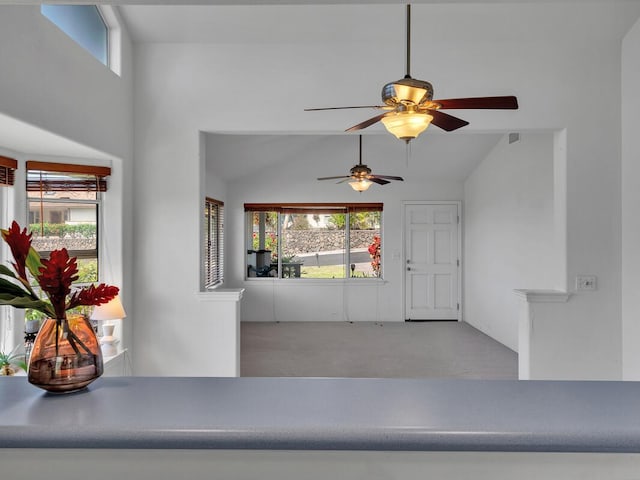 carpeted foyer featuring ceiling fan