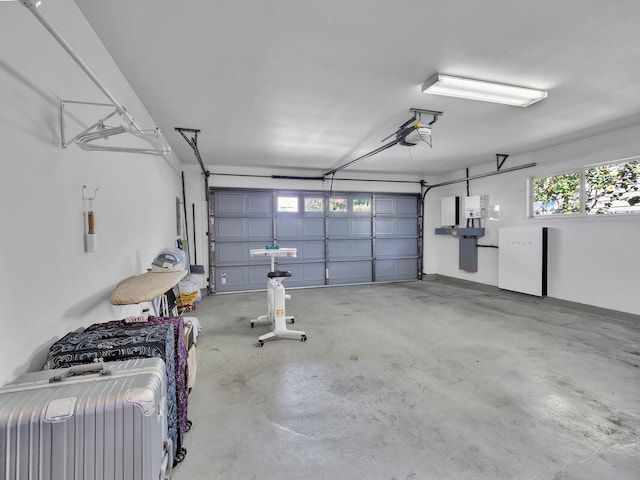 garage featuring refrigerator and a garage door opener