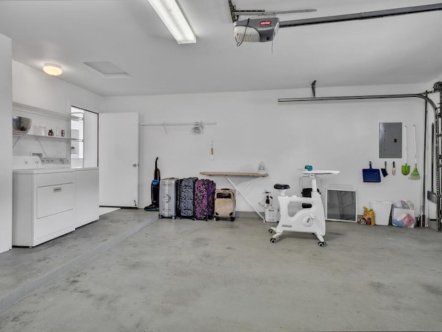 garage with separate washer and dryer, electric panel, and a garage door opener