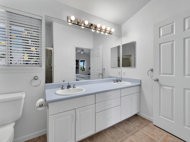 bathroom with ceiling fan, vanity, tile patterned flooring, and toilet