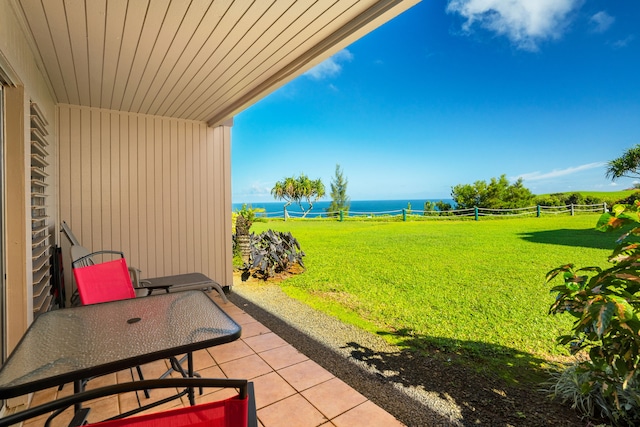 view of yard featuring a water view and a patio