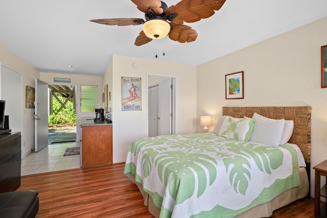 bedroom with a closet, access to exterior, ceiling fan, and light hardwood / wood-style flooring