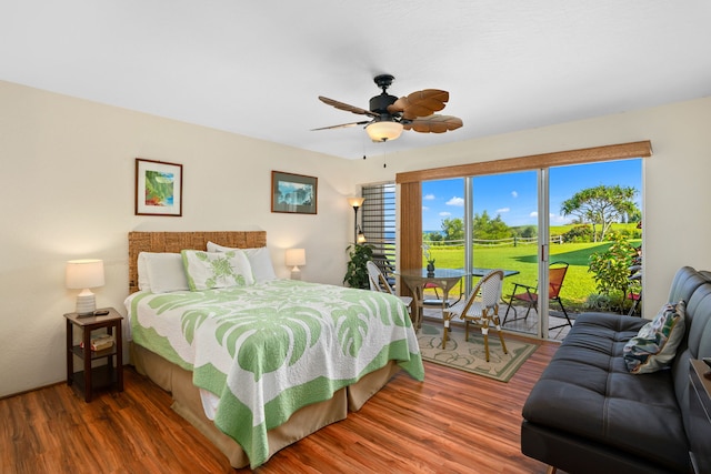 bedroom with access to outside, ceiling fan, and hardwood / wood-style floors