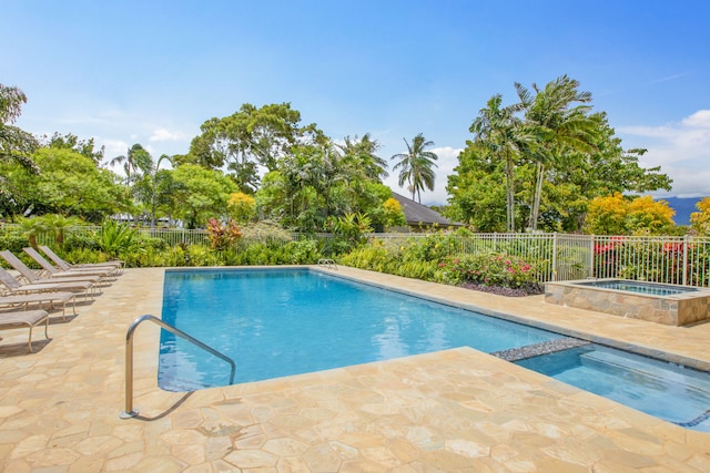 view of swimming pool featuring a patio area and a community hot tub