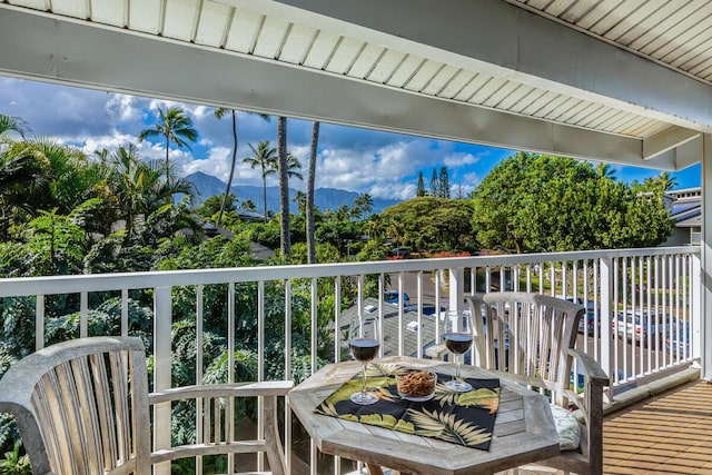 balcony featuring a mountain view