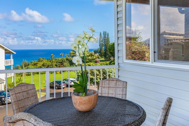 balcony featuring a water view