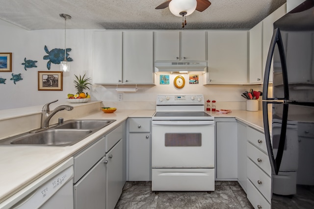 kitchen with sink, white cabinets, hanging light fixtures, white appliances, and a textured ceiling