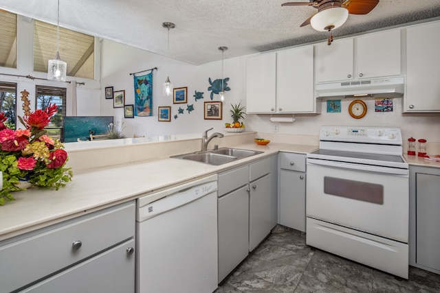 kitchen featuring sink, white appliances, hanging light fixtures, and white cabinets