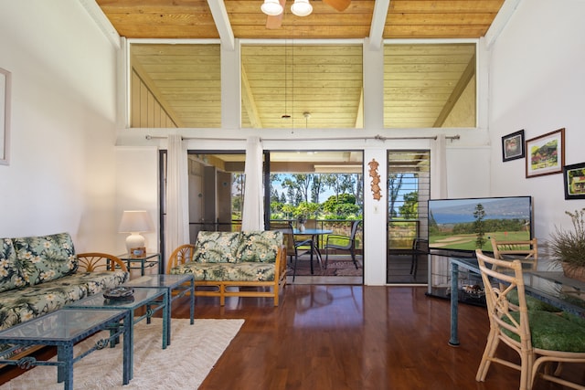 living room with wood ceiling, wood-type flooring, and a towering ceiling