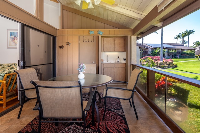 interior space featuring wood ceiling, ceiling fan, and vaulted ceiling with beams